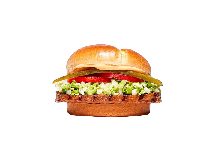 A gourmet burger with a grilled beef patty, fresh lettuce, diced tomatoes, pickles, and a glossy bun, isolated on a solid black background.